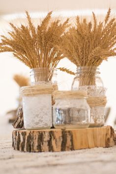 three mason jars filled with rice sitting on top of a table