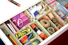 a drawer filled with lots of craft supplies