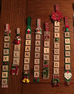 christmas scrabbles are laid out on a table with bows, ribbons and ornaments