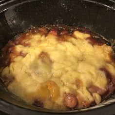 the food is being cooked in the pot on the stove top and ready to be eaten