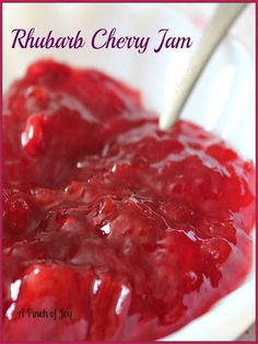 a white bowl filled with cranberry sauce on top of a table