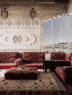 a living room filled with red couches next to a large painting on the wall