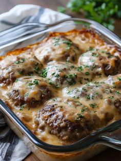 a casserole dish with meatballs and cheese