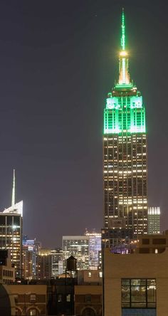 the empire building lit up in green for st patrick's day