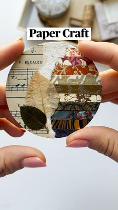 two hands holding up a piece of paper with music notes on it and the words paper craft above them