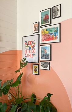 there are many pictures on the wall with plants