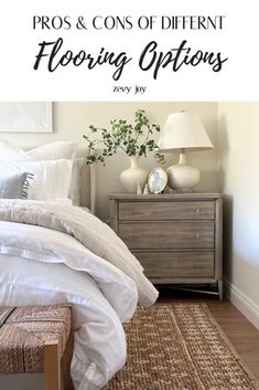 a bed with white linens and pillows on top of it next to a dresser