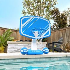 an inflatable basketball hoop sitting on top of a pool next to a chair