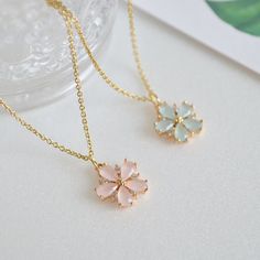 Dainty Custom Cherry Blossom necklace in gold. ♥ You can buy the matching earrings from following link. https://www.etsy.com/listing/1493723272 https://www.etsy.com/listing/167001667 ♥ Material - 18K gold plated over brass, Glass stone, Zircon ♥ The chain length - 14 ~ 20 inches (adjustable chain) ♥ Measurement - 13mm ♥ All the jewelry comes with gift wrap ♥ Please check the shop policy before you buy the products. Cute Flower Shaped Jewelry For Mother's Day, Delicate Flower Shaped Necklace For Bridesmaid Gift, Cute Rose Gold Flower Jewelry, Cute Gold Flower-shaped Jewelry, Dainty Flower-shaped Jewelry For Bridesmaids, Feminine Petal-shaped Jewelry Gift, Delicate Flower Shaped Jewelry For Bridesmaid Gift, Gold Flower Shaped Jewelry For Bridesmaid Gift, Cute Rose Gold Flower-shaped Jewelry