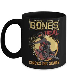 a black coffee mug with the words bones heal and a man on a dirt bike