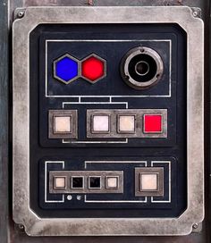 an old metal panel with different colored buttons