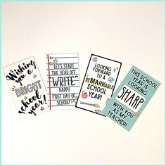 four different types of school cards on a white surface