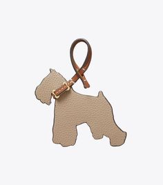 a dog shaped keychai with a brown leash on it's side and a white background