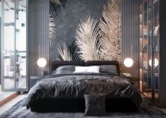 a large bed sitting in a bedroom next to a tall wall with palm leaves on it