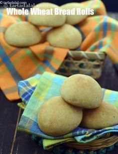 some food that is sitting in a basket on a table with cloths and napkins