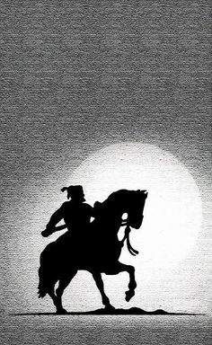 a man riding on the back of a horse across a field at sundown in black and white