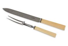 two knives with wooden handles are next to each other