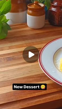 a plate with some food on it sitting on a wooden table next to potted plants