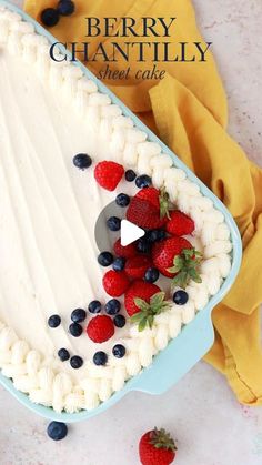 a cake with berries and blueberries on it