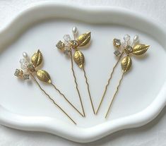 Beautiful 3 pieces bronze leaf flower hair pins with gold crystals and pearls on bronze hair pins.  The perfect hair accessories for brides, bridesmaid and flowe girl. Also suitable for proms, party and other formal events.  Ship with Royal Mail, express delivery also available at checkout. Thank you for visiting my shop.  Allbeautifulbybren x Bronze Hair, Gold Crystals, Leaf Flower, Bride Hair Accessories, Wedding Hair Pins, Flower Hair Pin, Luxury Hair, Stick Pins, Gold Crystal