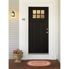 a black front door on a white house