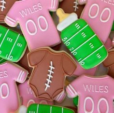 cookies decorated to look like sports jerseys and footballs