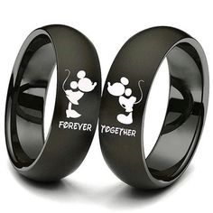 two black rings with mickey mouse and forever together written on the inside of each ring