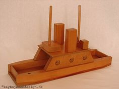 a wooden model of a boat with four oars