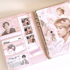 a pink album with photos and writing on the cover is opened to show an individual's profile