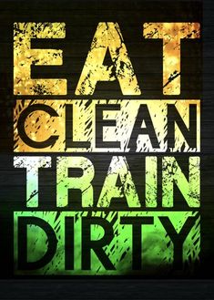 the words eat clean train dirty are painted in green and yellow on a black background