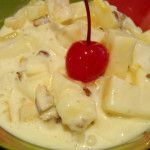 a bowl filled with ice cream and topped with a cherries garnish on top