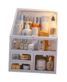 a white shelf filled with lots of different types of skin care and beauty products on top of each other