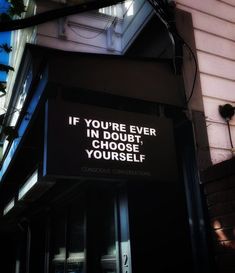 a sign on the side of a building that says if you're ever in doubt, choose yourself yourself