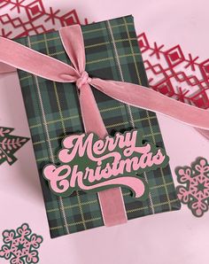 a green and pink christmas card with the words merry christmas on it