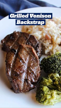 steak, broccoli and rice on a plate with a blue towel in the background