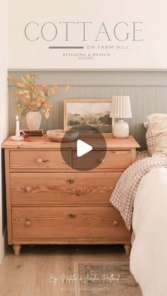 a bed room with a wooden dresser next to a lamp and pictures on the wall