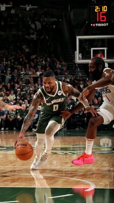 two basketball players in action on the court