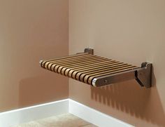 a towel rack in the corner of a bathroom