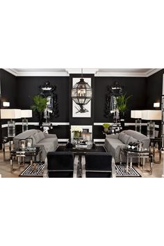 a living room filled with furniture and black walls