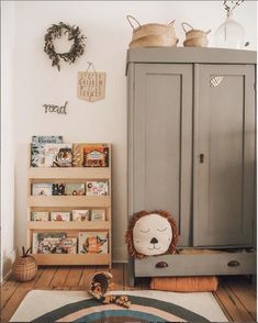 a child's room with a bookcase, bookshelf and stuffed animal