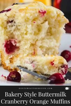 a close up of a piece of cake on a plate with cranberry orange muffins