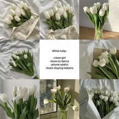 white tulips in a vase sitting on a bed