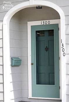 a blue front door with the number 18000 on it's side and an entry way