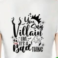 a person wearing a white shirt with the words you say villain like it's a bad thing