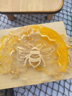 a glass plate with a bee on it