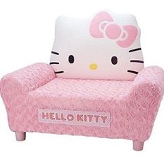 a pink hello kitty chair sitting on top of a white floor