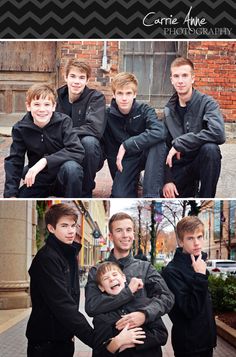 four boys are posing for a photo in front of a brick building with their arms around each other