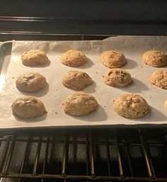 twelve cookies are being baked in the oven