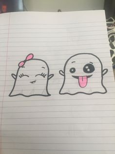 a piece of paper with two ghost faces drawn on it