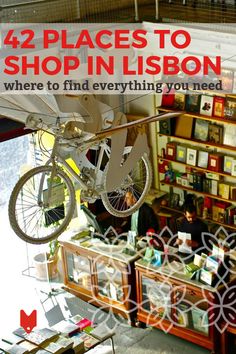 a bike hanging from the ceiling in a shop with text overlay that reads, 42 places to shop in lisbon where to find everything you need